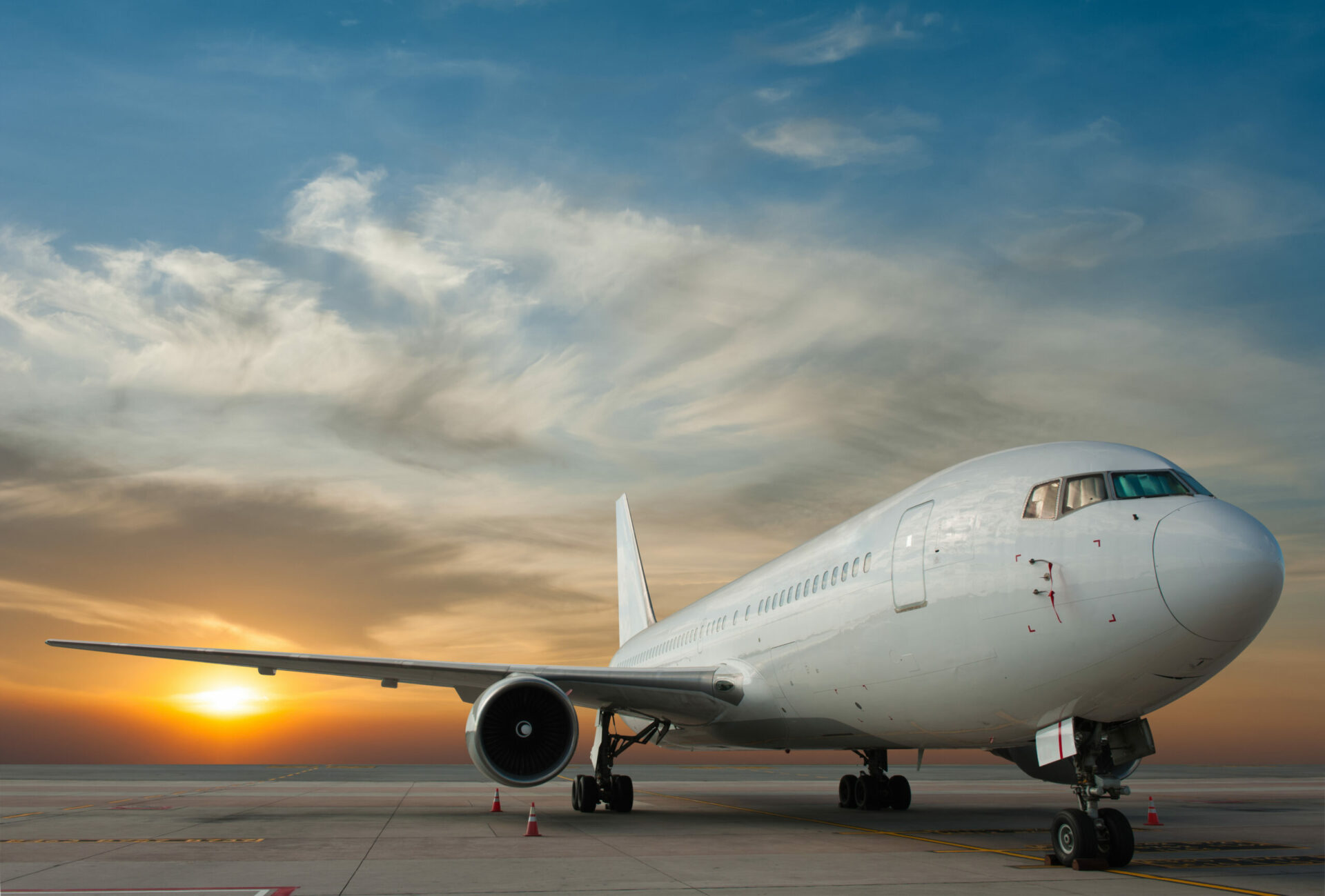 Commercial airplane with sunset